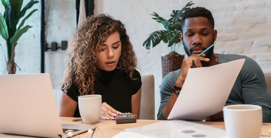 couple reviewing their health insurance for fertility benefits