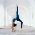 Woman doing one of the most difficult yoga poses that help boost fertility