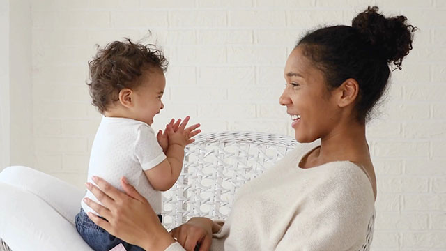 Happy mom and baby with Genesis Fertility New York