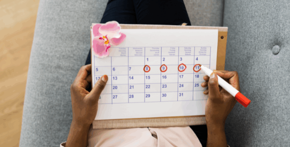 A woman marking off the days on a calendar after an embryo transfer.